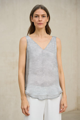 Top Érima gris perla